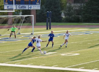 Freshman Sierra Springer makes a shot on goal against Bethany College (Image Credit: Kayla Korb)