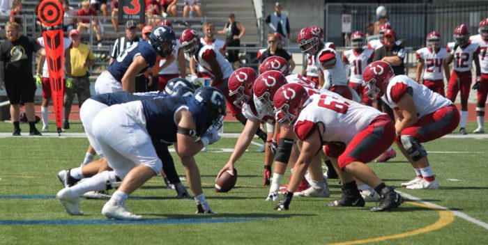 The Bulldog Football team faces the Broncos on third down (Image credit: Kayla Korb)