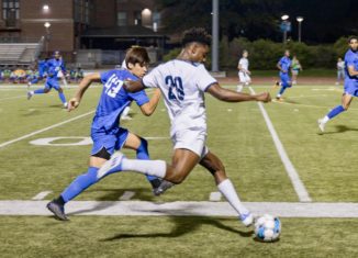 Senior Daniel Campbell battles for the ball (Image Credit: Tobias Novak)