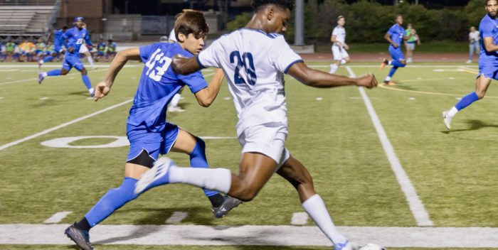 Senior Daniel Campbell battles for the ball (Image Credit: Tobias Novak)